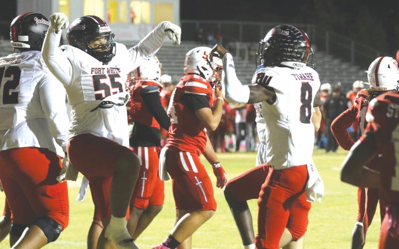 Fort White quarterback Jayden Jackson (right) and offensive lineman Tayvin Fleming celebrate following Jackson’s first touchdown during last Friday’s 35-6 win over Hamilton County. (MORGAN MCMULLEN/Lake City Reporter)