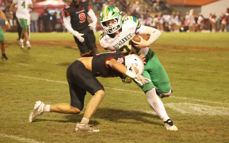 Suwannee tight end Hunter Watson is tackled after a catch against Baker County on Friday. (PAUL BUCHANAN/Lake City Reporter)