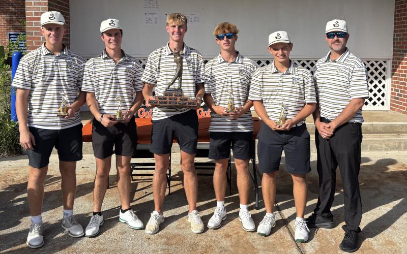 The Suwannee boys golf team shows off its trophy after winning the Ann and John Ives Invitational on Thursday. (COURTESY)