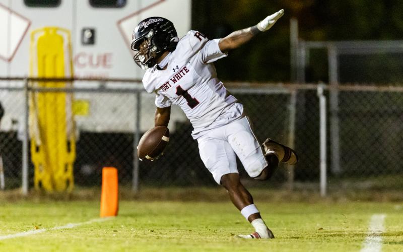 Fort White running back John’l Lawson celebrates after scoring a touchdown against Lafayette last Friday. (JACK HOWDESHELL/Lake City Reporter)