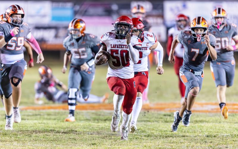 Lafayette’s Zamarion Hawkins returns a fumble for a touchdown against Trenton on Friday. (JACK HOWDESHELL/Lake City Reporter)