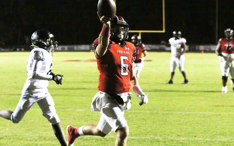 Fort White quarterback Matthew Pitts celebrates after a touchdown Friday against Zarephath Academy. (MORGAN MCMULLEN/Lake City Reporter)