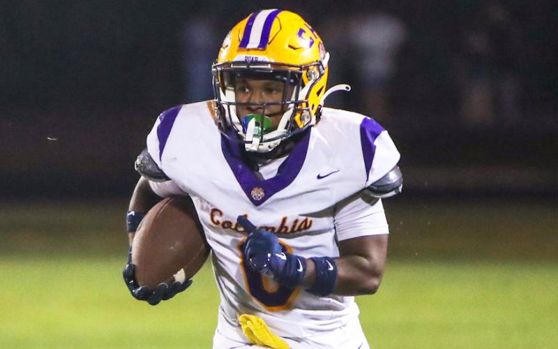 Columbia running back Jeffery Pope looks for running room against Ridgeview on Friday. (BRENT KUYKENDALL/Lake City Reporter)
