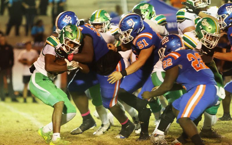 Suwannee running back Lou Jack Smith is corralled by Taylor County defenders on Oct. 17. (PAUL BUCHANAN/Lake City Reporter)