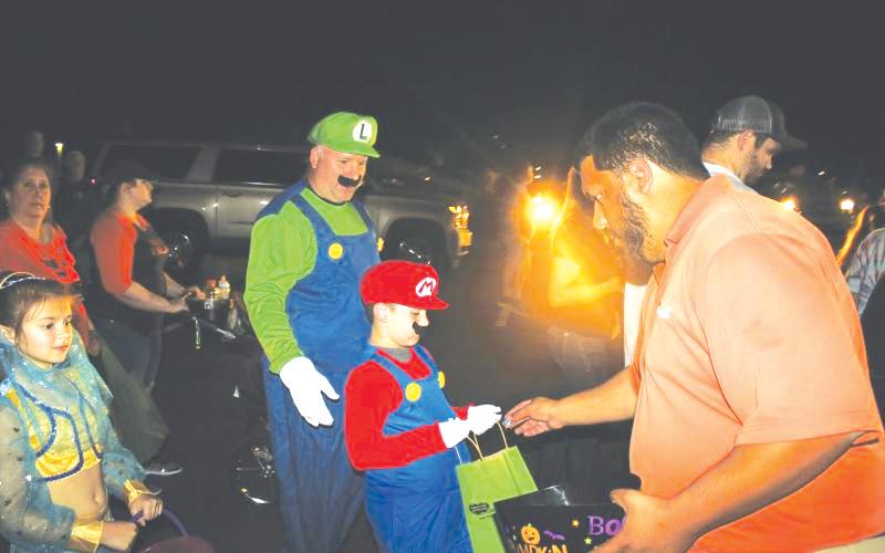 Robert Stalvey and Hagan Stalvey, then 7, dressed up as Mario and Luigi during the 2019 Trunk or Treat event. (FILE)