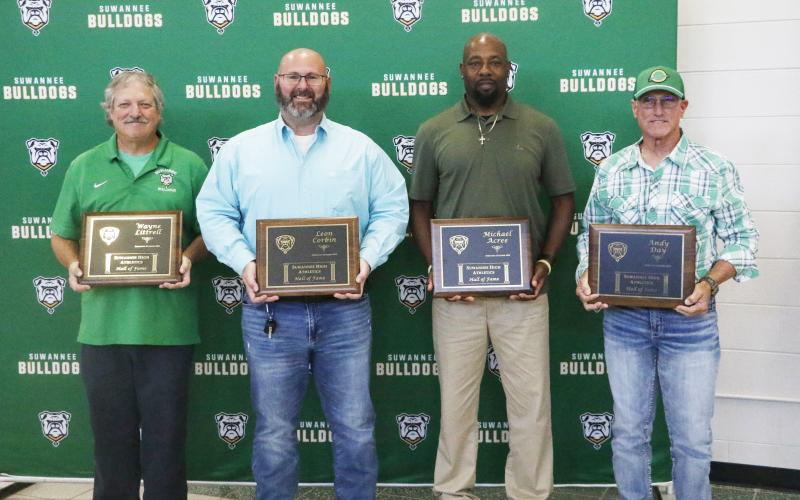 Wayne Littrell (from left), Lee Corbin, Michael Acree and Andy Day were inducted into the Suwannee Hall of Fame last Thursday. (JAMIE WACHTER/Lake City Reporter)