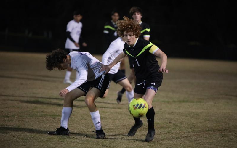 Columbia's Brendan Schwartz chases after possession of the ball during a match against Gainesville last season. (BRENT KUYKENDALL/Lake City Reporter)