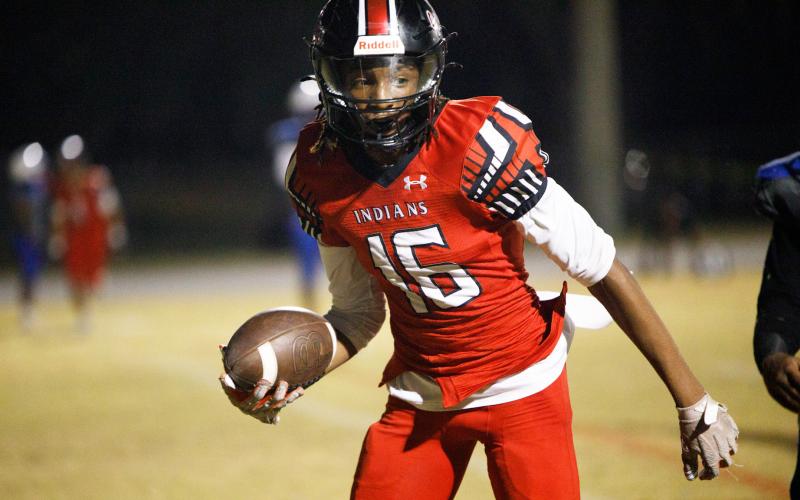 Fort White receiver Desean Lally scores a touchdown against Wildwood during the FIT quarterfinals on  Nov. 20. (BRENT KUYKENDALL/Lake City Reporter)