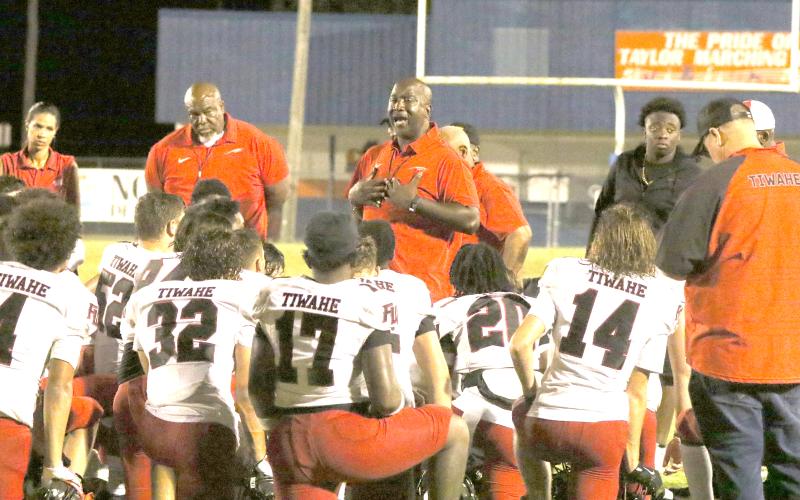 Fort White coach Demetric Jackson addresses his team following a 20-3 loss to Taylor County on Aug. 22. (MORGAN MCMULLEN/Lake City Reporter)
