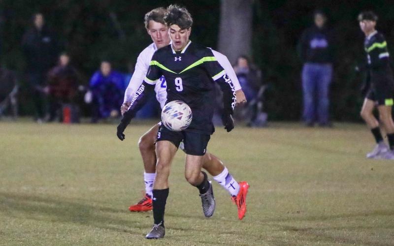 Columbia's Braxton Dicks chases down possession of the ball against Keystone Heights on Nov. 10. (BRENT KUYKENDALL/Lake City Reporter)