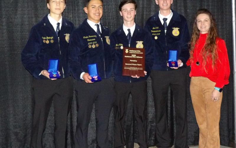 The Lafayette FFA Forestry Evaluation Team finished as national runner-up at the 98th annual National FFA Convetion &amp; Expo in Indianapolis on Oct. 29-31. Team members were Levi Smith, Fhelix Hernandez, Caden Boatright and Boone Riley, who are pictured with Advisor Tori Lyons. (COURTESY)