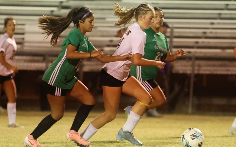 Columbia's Leah Shields dribbles in to score a goal against Suwannee on Thursday. (PAUL BUCHANAN/Lake City Reporter)