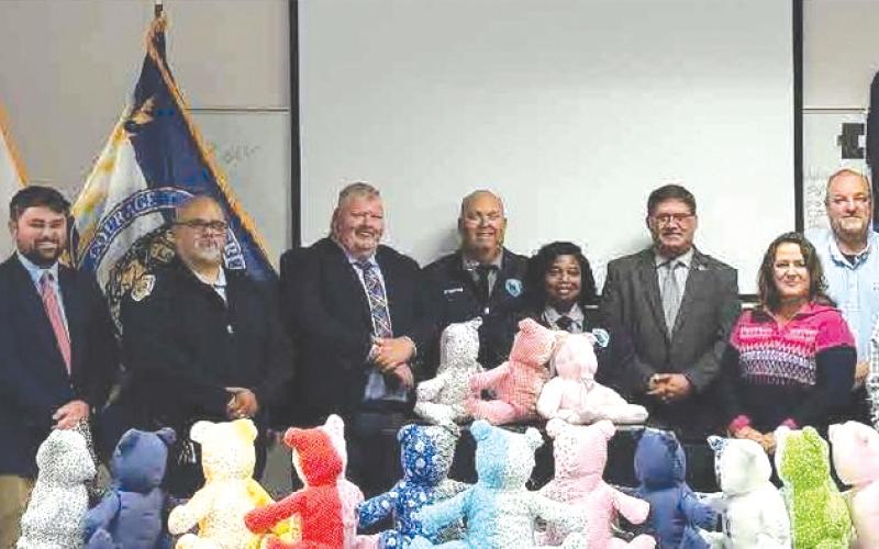 Representatives from the Columbia Correctional Institution and Lake City Police Department teamed up to give local inmates the materials necessary to build teddy bears to be used for kids in domestic violence situations. (COURTESY LAKE CITY POLICE DEPARTMENT)