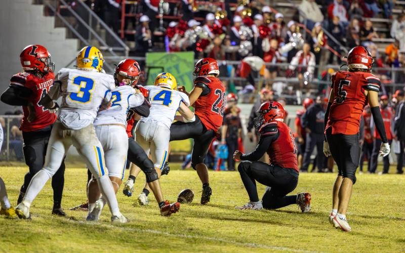 Chipley linebacker Tucker Locke blocks Lafayette kicker Alex Townsend’s extra point attempt that ended up being the difference in the game Friday. (JACK HOWDESHELL/Lake City Reporter)
