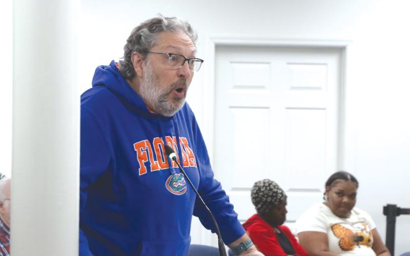 Former Lake City Councilman Todd Sampson (left) addresses the council regarding its housing plan during Monday’s workshop. (MORGAN MCMULLEN/Lake City Reporter)
