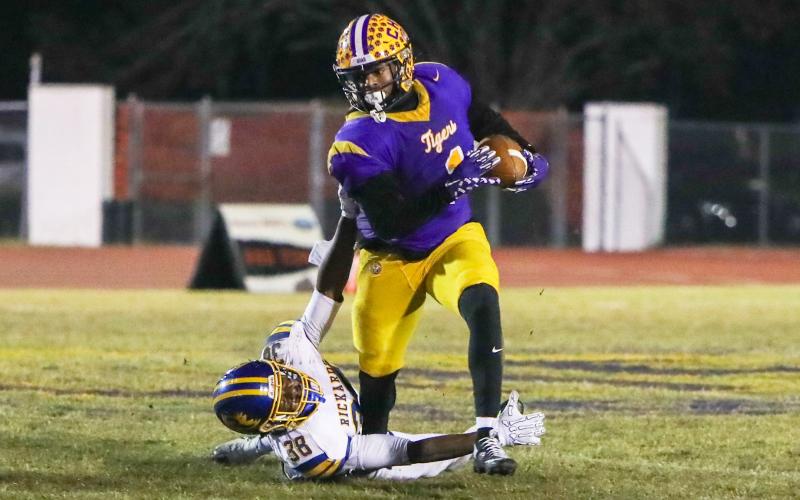 Columbia running back Kameron shakes off Rickards linebacker Marlon Wilson after stiff-arming him on his way to a 41-yard touchdown run during Friday’s Region 1-4A quarterfinal. (BRENT KUYKENDALL/Lake City Reporter)
