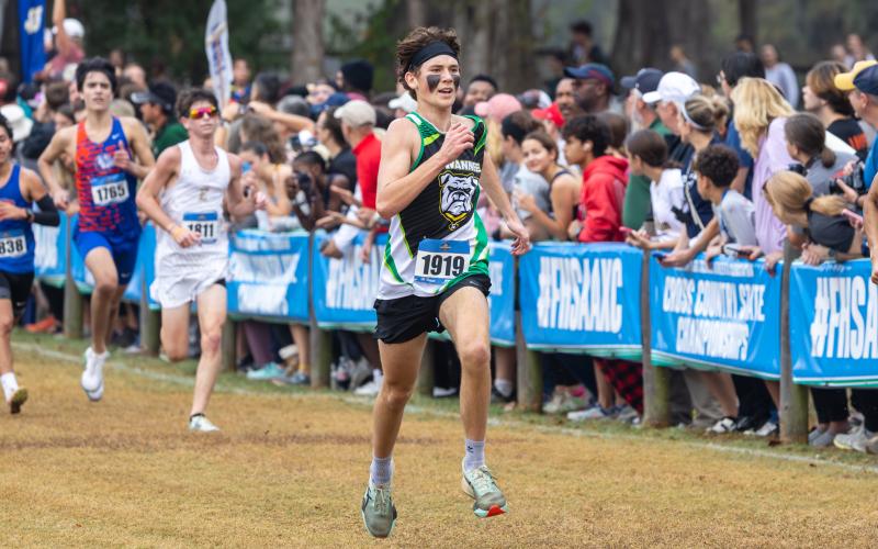 Suwannee runner Logan Haley kicks it into gear at the Class 2A state meet on Saturday. (JACK HOWDESHELL/Lake City Reporter)