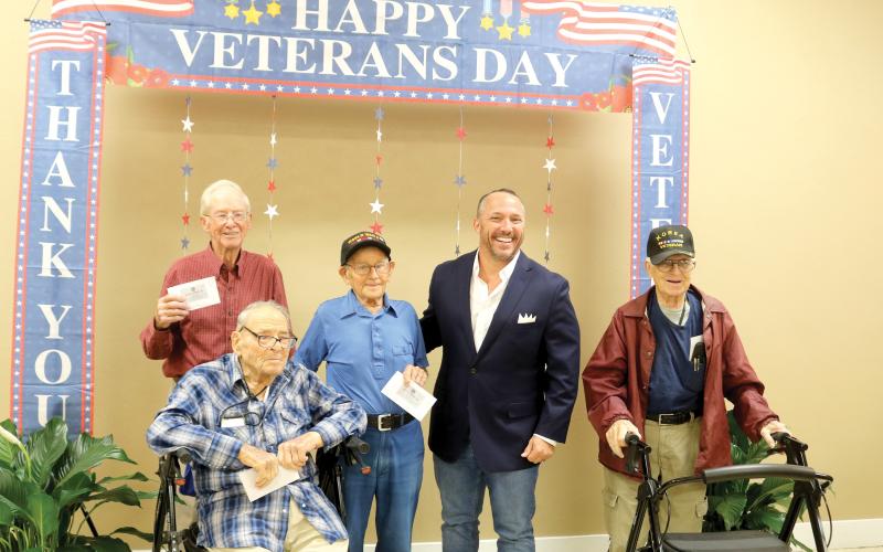 The oldest veterans to attend the annual veterans barbecue luncheon posed for a picture with State Rep. Danny Alvarez during the event. Pictured from left are: Leonard Kenneth Keen, 94, Army veteran; Donald Christensen, 95, Air Force veteran; Ray DeCant, 100, World War II veteran, State Rep. Danny Alvarez and Walt Lhamon, 93, Air Force veteran. (TONY BRITT/Lake City Reporter)