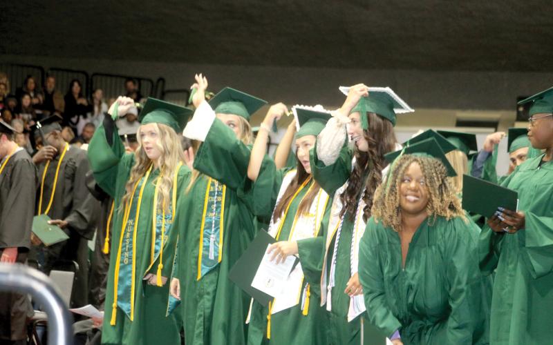 Florida Gateway College graduates turn their tassels after graduating during the college’s commencement ceremony Tuesday evening at the Howard Center. (TONY BRITT/Lake City Reporter)