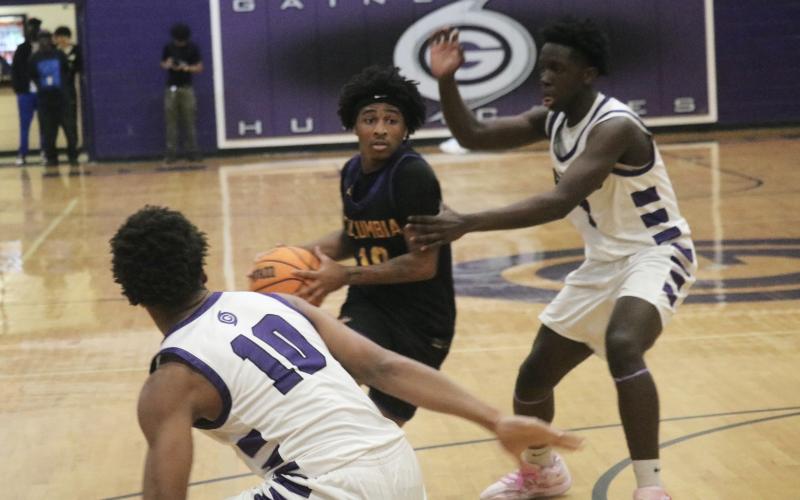 Columbia guard Zadrian Knowlton drives into the lane against Gainesville on Tuesday. (JORDAN KROEGER/Lake City Reporter)