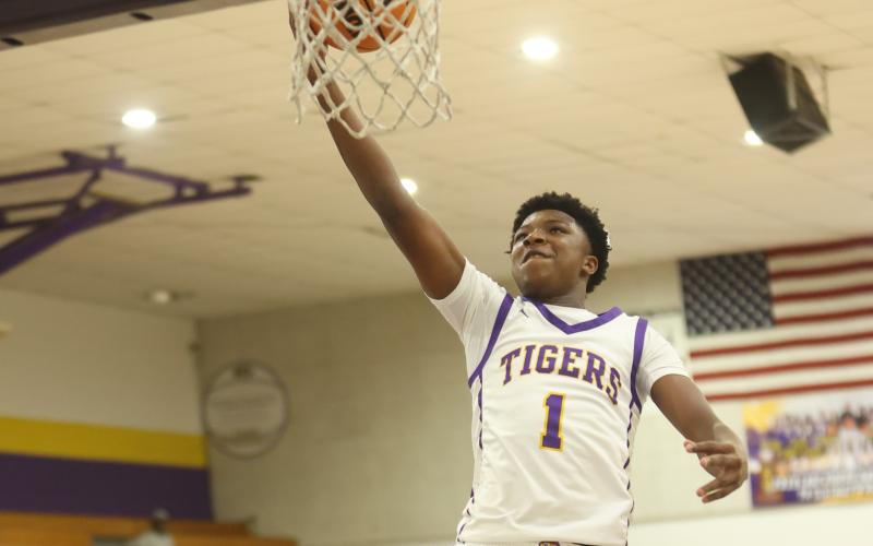 Columbia guard Shaheed White drives to the basket for a layup against Suwannee on Friday. (PAUL BUCHANAN/Lake City Reporter)