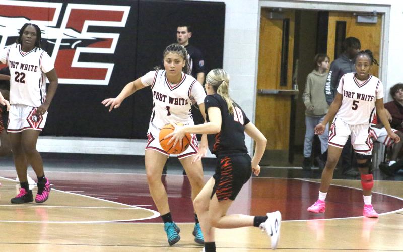 Fort White guard Mariah Cox (1) defends against Trenton's Grace Griffis during Tuesday's 70-22 win. (MORGAN MCMULLEN/Lake City Reporter)