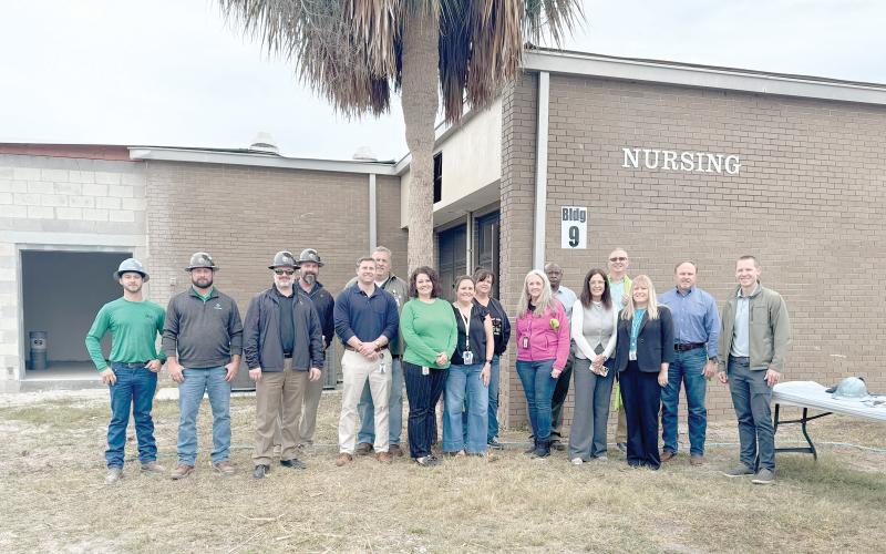 Suwannee County School District officials and representatives from Scorpio held a topping out ceremony Monday on the new nursing building addition at RIVEROAK Technical College. (COURTESY TJ VICKERS/Suwannee County School District)