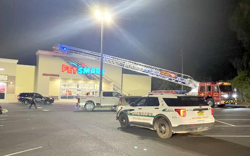 A special needs child was rescued from the roof of PetSmart on Wednesday night by Lake City police officers and Lake City firefighters. (COURTESY LAKE CITY FIRE DEPARTMENT)