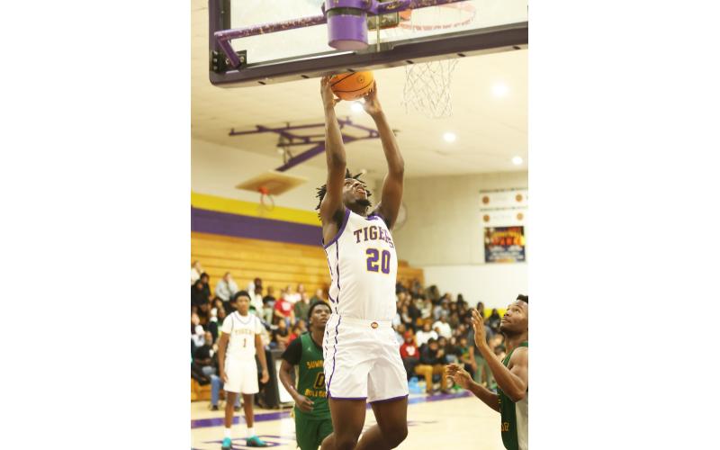 Columbia center Terrance Tolbert rises for a layup against Suwannee on Dec. 12. (PAUL BUCHANAN/Lake City Reporter)