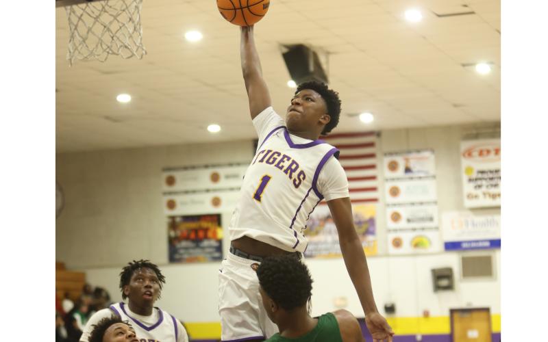 Columbia guard Shaheed White, soaring in for a bucket against Suwannee on Dec. 12, leads the Tigers offensively heading into this weekend’s Holiday Hoopfest in Fort Myers. (PAUL BUCHANAN/Lake City Reporter)