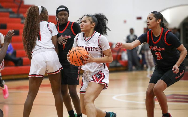 Fort White guard Mariah Cox tries to find a driving lane against Williston on Tuesday. (BRENT KUYKENDALL/Lake City Reporter)