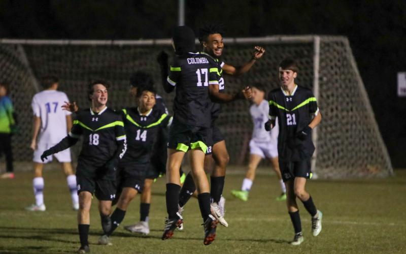 Columbia's Josiah Hopkins (12) celebrates with teammates after scoring a goal against Keystone Heights on Nov. 10. 2025. (BRENT KUYKENDALL/Lake City Reporter)