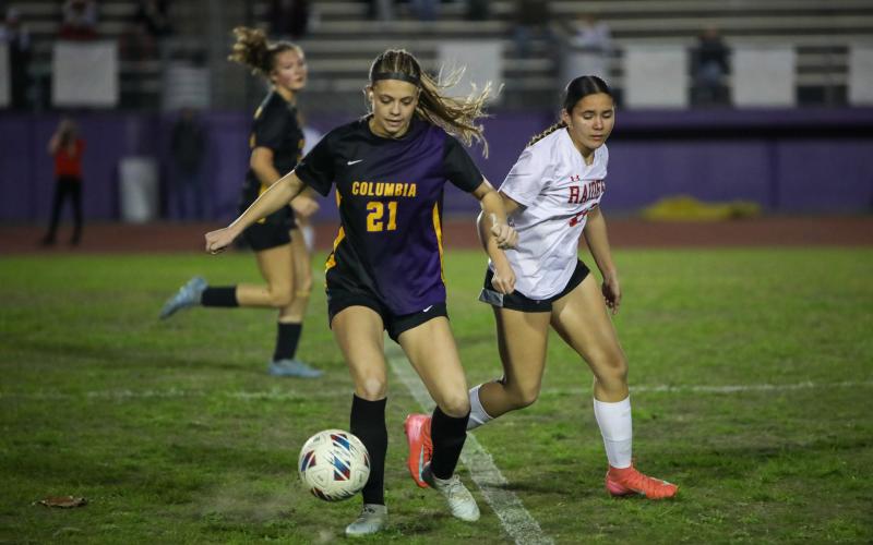 Columbia's Laelle Thompson gathers possession of the ball against Santa Fe on Tuesday. (BRENT KUYKENDALL/Lake City Reporter)