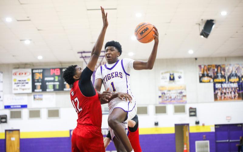 Columbia guard Shaheed White goes up for a layup against The Rock on Jan. 6. (BRENT KUYKENDALL/Lake City Reporter)