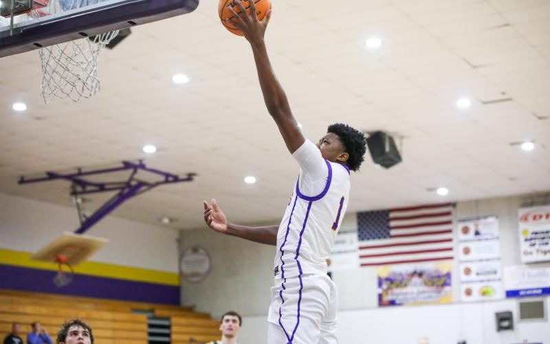 Columbia guard Shaheed White makes a layup against Buchholz on Tuesday. (BRENT KUYKENDALL/Lake City Reporter)