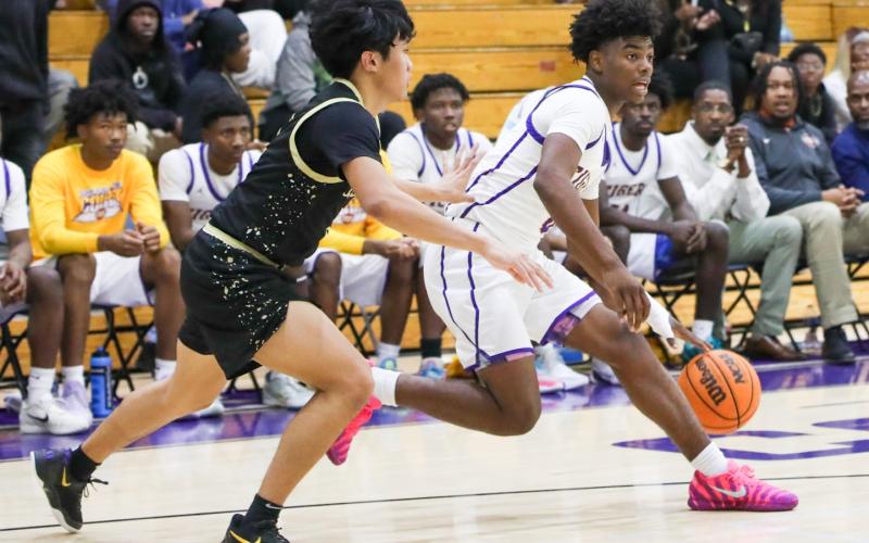Columbia guard Murkail Cray drives to the basket against Buchholz on Jan. 13. (BRENT KUYKENDALL/Lake City Reporter)