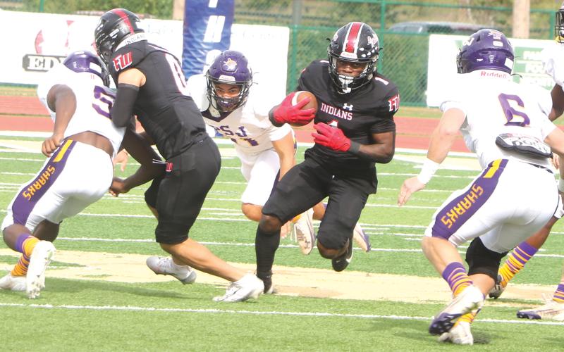 Fort White running back John’l Lawson hits the hole against Port St. Joe during the FIT Championship on Dec. 5, 2025. (FILE)