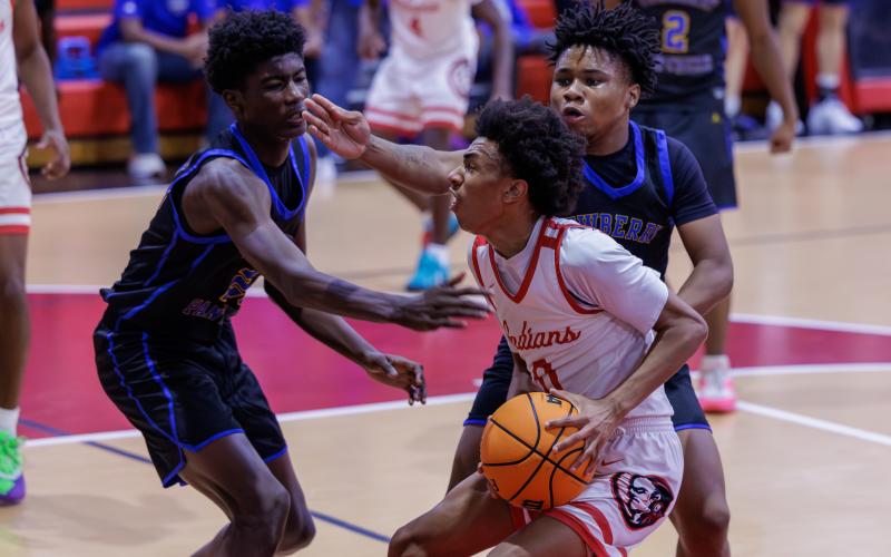 Fort White guard Tylan James drives to the basket against Newberry on Dec. 19. (JACK HOWDESHELL/Lake City Reporter)