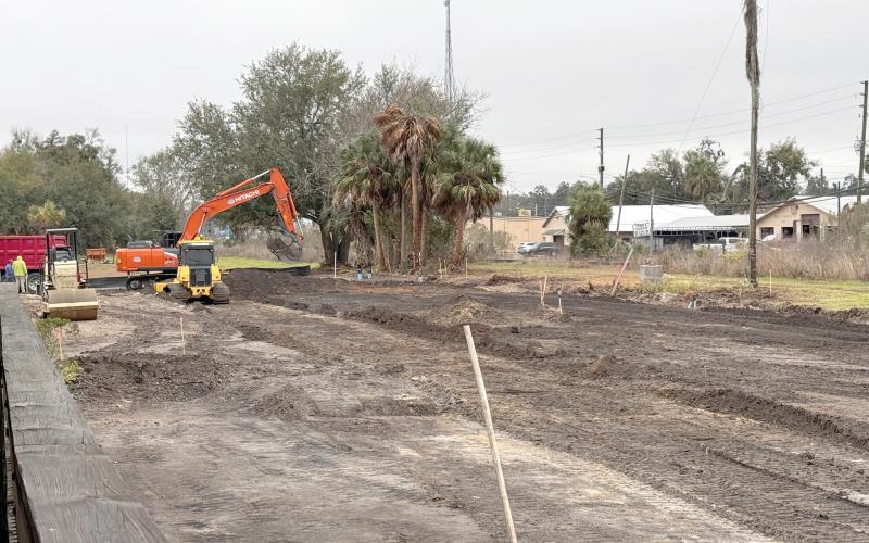 Curt’s Construction crews have begun work on parking improvements at the Heritage Square redevelopment area next to the Suwannee County Historical Museum. (JAMIE WACHTER/Lake City Reporter)