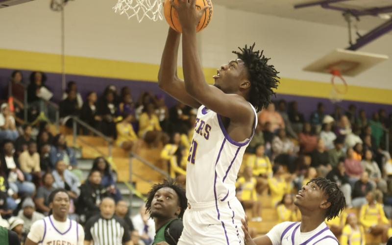 Columbia center Terrance Tolbert goes up for a layup against Suwannee on Dec. 12. (PAUL BUCHANAN/Lake City Reporter)