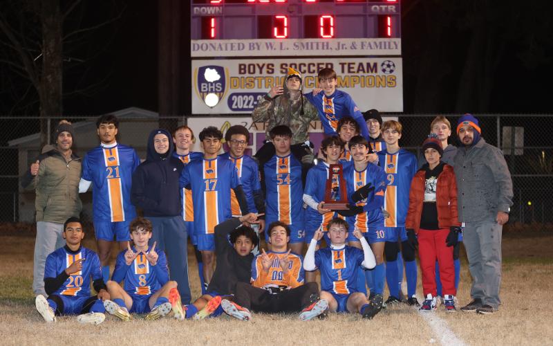 The Branford boys soccer team shows off the District 2-2A championship trophy after defeating Hamilton County 5-0 on Tuesday. (PAUL BUCHANAN/Lake City Reporter)