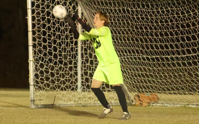 Columbia goalkeeper Logan Wheeldon makes a save against Suwannee on Dec. 1. (PAUL BUCHANAN/Lake City Reporter)