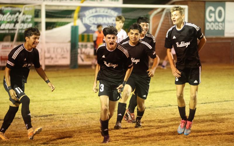 Suwannee's Rember Alonso (3) celebrates with teammates after scoring a goal against Williston on Nov. 21, 2025. (PAUL BUCHANAN/Lake City Reporter)