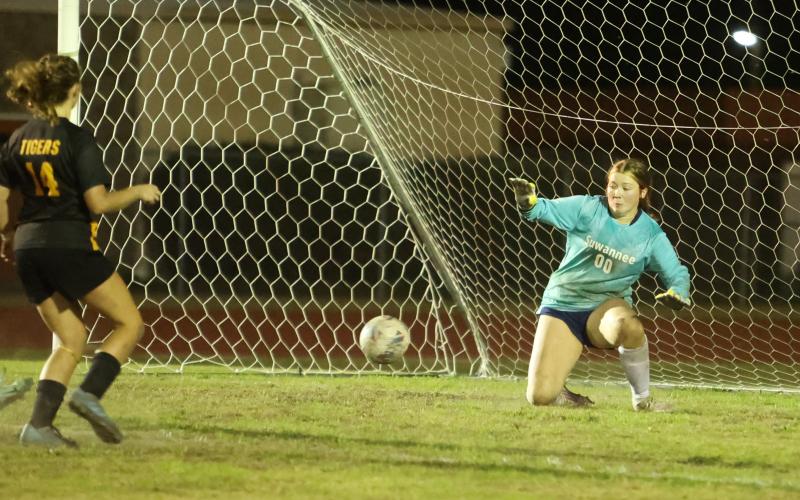 Suwannee goalkeeper Felicity May stops a shot from Columbia's Leah Shields on Friday. (PAUL BUCHANAN/Lake City Reporter)