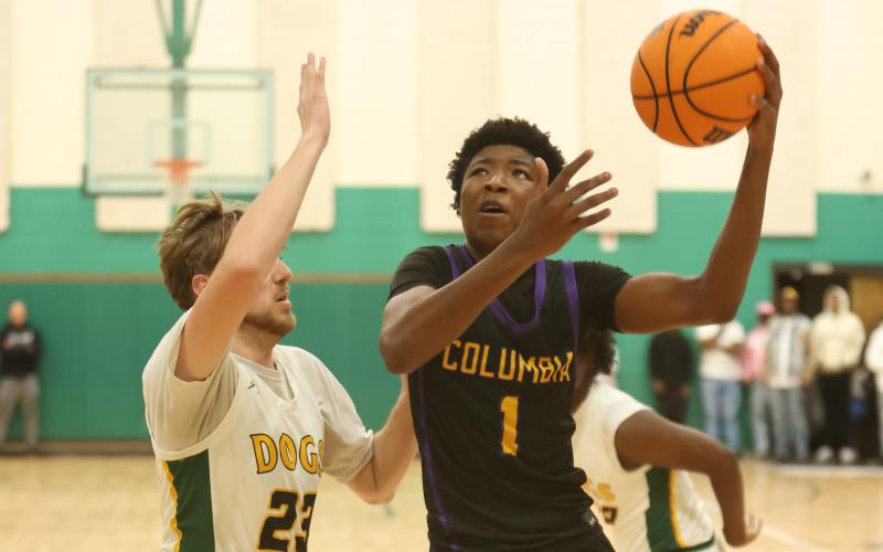 Columbia guard Shaheed White drives to the basket against Suwannee on Friday. (PAUL BUCHANAN/Lake City Reporter)