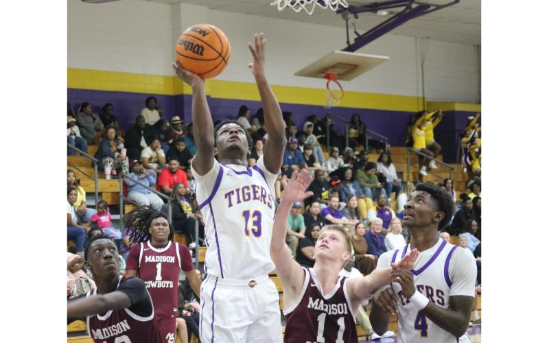 Columbia guard Jordaeton Youmans makes a layup against Madison County on Friday. (JORDAN KROEGER/Lake City Reporter)