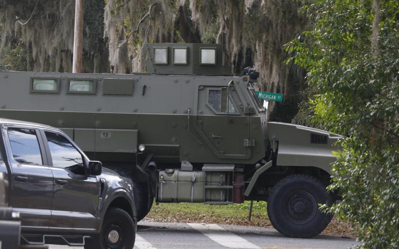 A SWAT team armored vehicle pulls onto SW Michigan Street on Monday afternoon during the search for an armed burglary suspect. The suspect, described as a tall male in dark clothing, was not captured. (JAMIE WACHTER/Lake City Reporter)