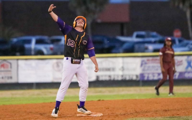 Columbia pitcher Kyler Keen celebrates at second base after hitting a two-RBI double against Episcopal on Thursday. (BRENT KUYKENDALL/Lake City Reporter)