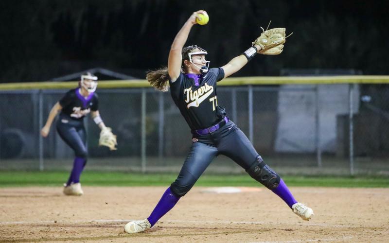 Columbia pitcher Ryleigh Stone winds up to pitch against Williston on Friday. (BRENT KUYKENDALL/Lake City Reporter)