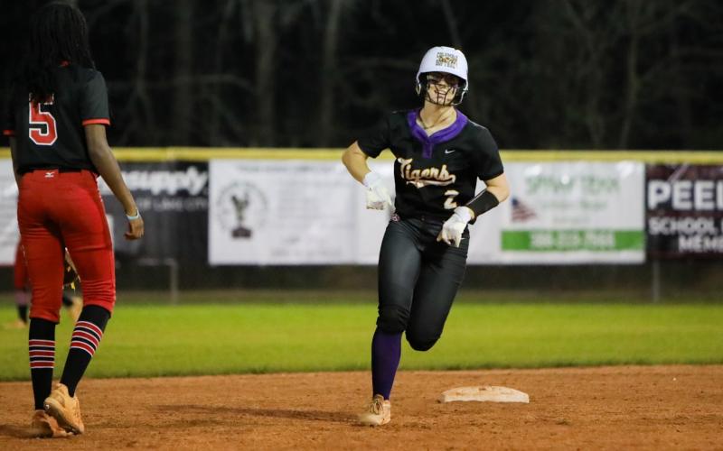 Columbia shortstop Alannah Lord rounds second base after hitting a three-run home run against Williston on Friday. (BRENT KUYKENDALL/Lake City Reporter)